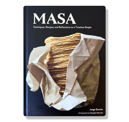 The cover of the cookbook titled 'MASA' showing a photograph of stacked corn tortillas wrapped in paper, with the author's name at the bottom.