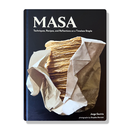 The cover of the cookbook titled 'MASA' showing a photograph of stacked corn tortillas wrapped in paper, with the author's name at the bottom.
