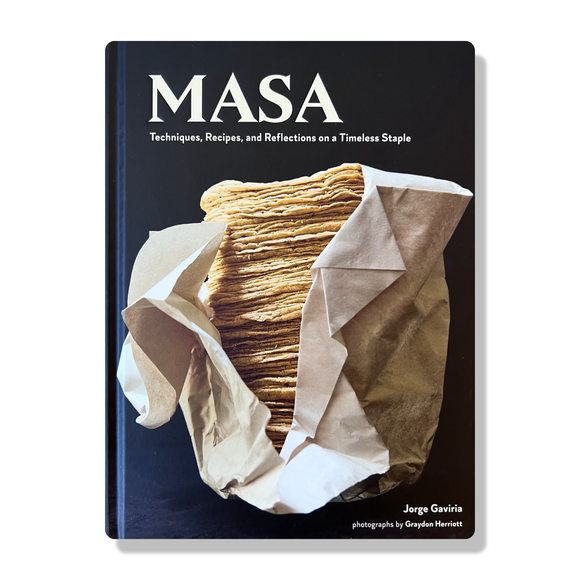 The cover of the cookbook titled 'MASA' showing a photograph of stacked corn tortillas wrapped in paper, with the author's name at the bottom.